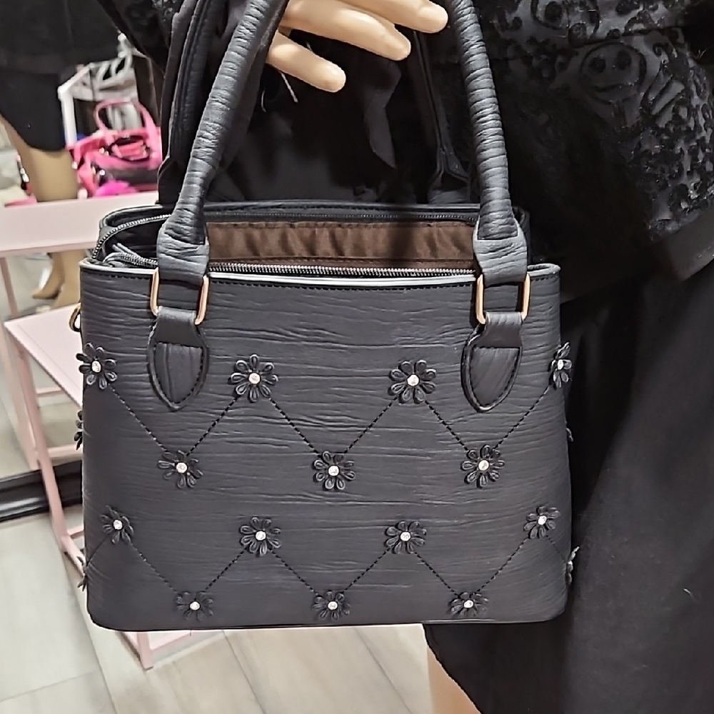 Elegant Black Handbag with Floral Accents